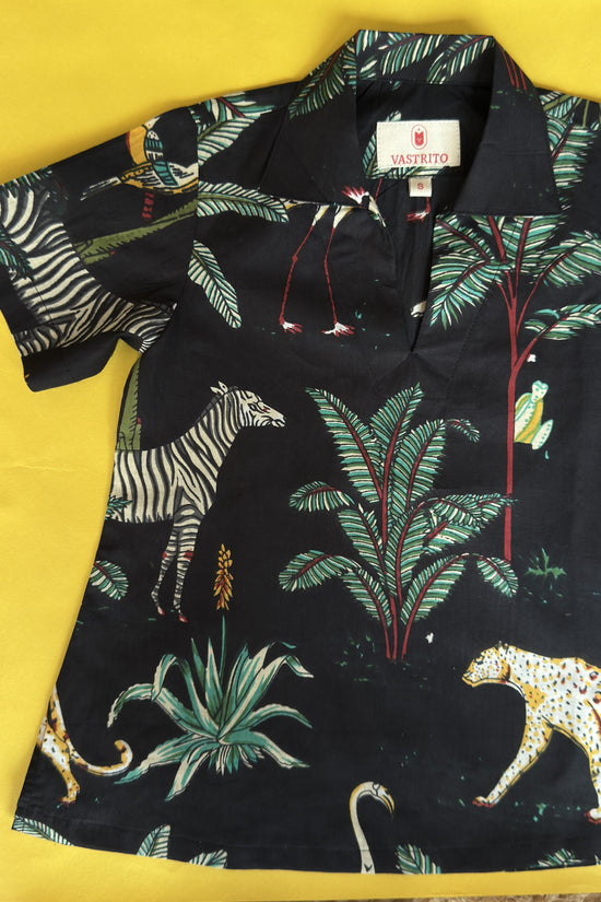 Black shirt with jungle-themed print on a yellow background