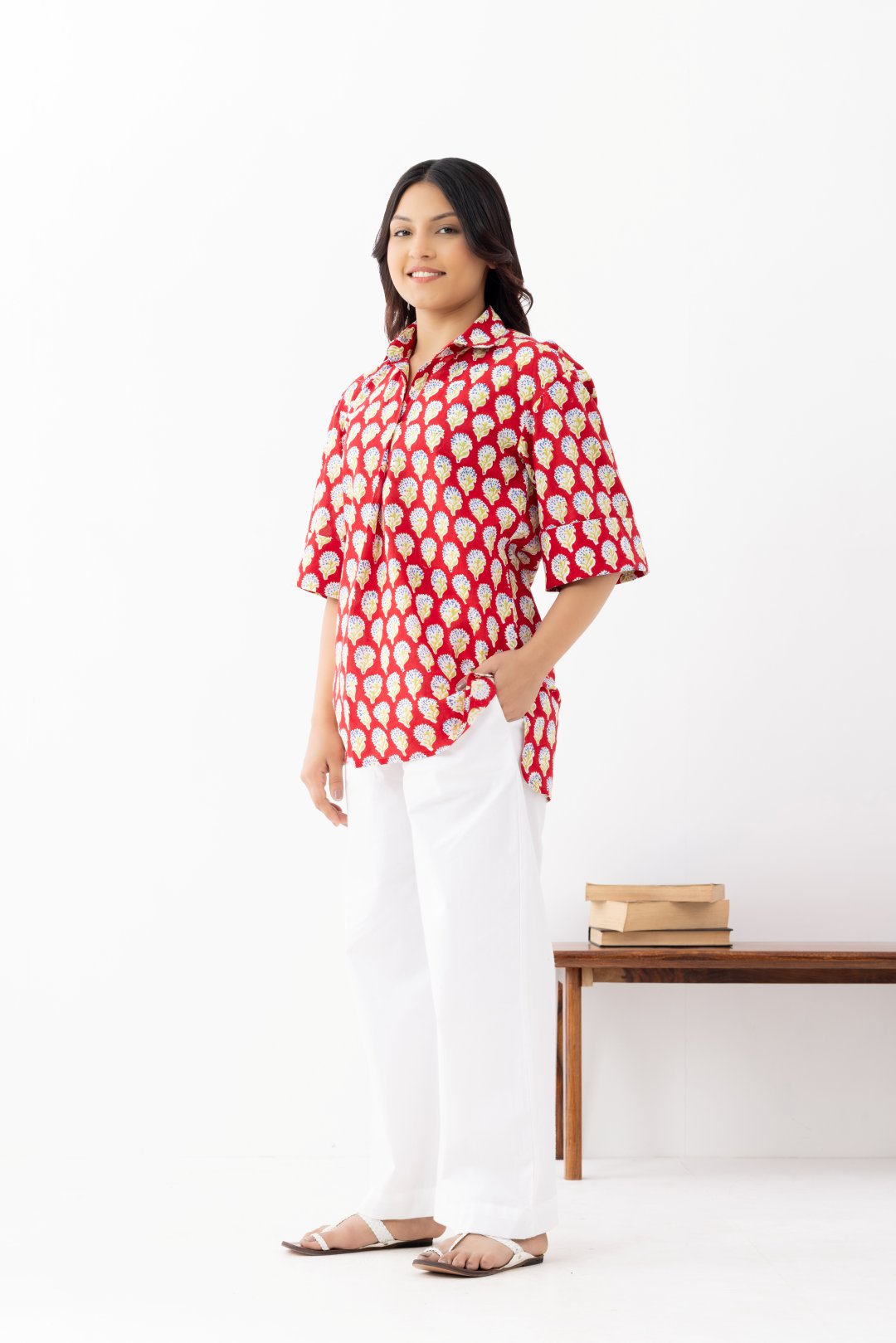 Woman wearing a pure linen cotton comfortable red and white block printed patterned shirt with regular collar and half sleeves