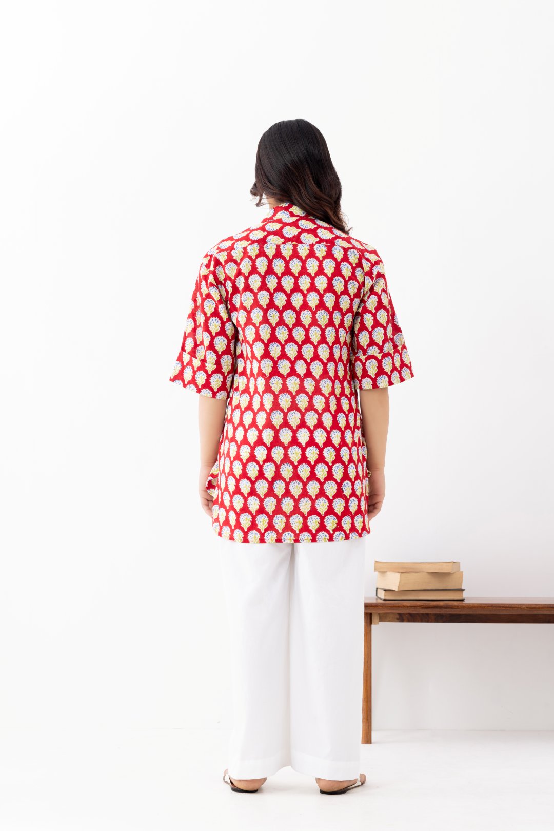 Woman wearing a pure linen cotton comfortable red and white block printed patterned shirt with regular collar and half sleeves