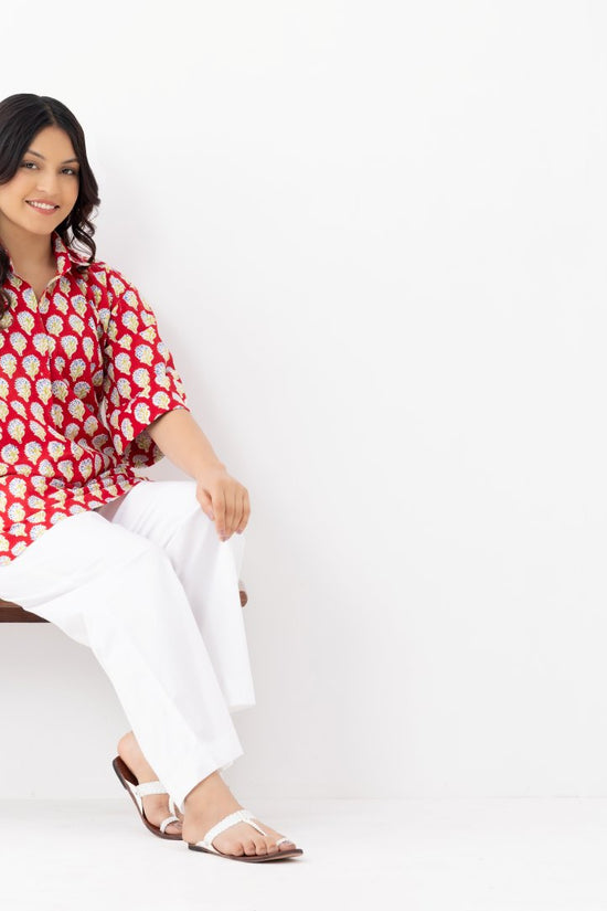 Woman wearing a pure linen cotton comfortable red and white block printed patterned shirt with regular collar and half sleeves