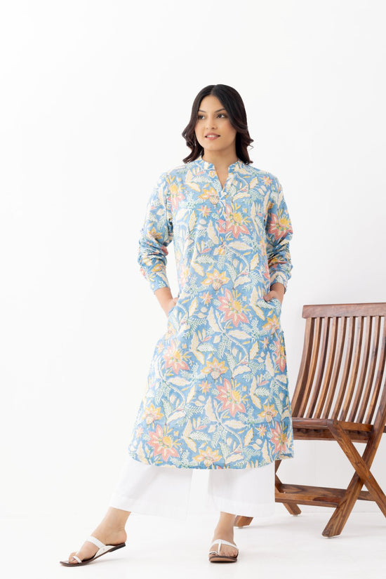 Woman wearing a pure linen cotton floral sky blue printed kurta with side pockets and mandarin collars