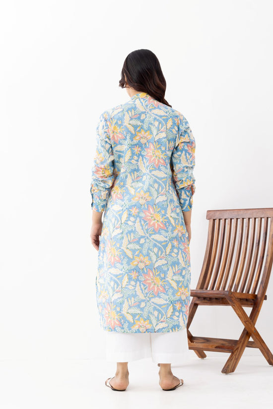 Woman wearing a pure linen cotton floral sky blue printed kurta with side pockets and mandarin collars