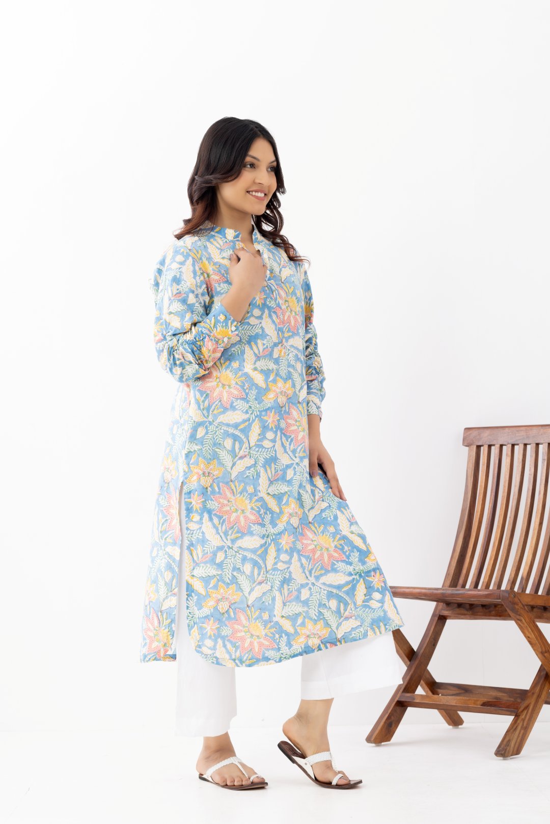 Woman wearing a pure linen cotton floral sky blue printed kurta with side pockets and mandarin collars