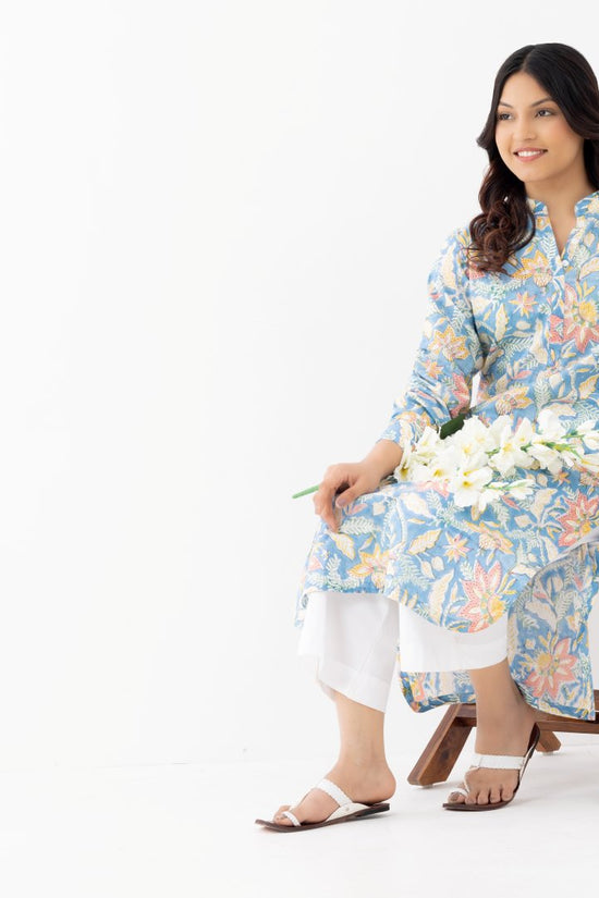 Woman wearing a pure linen cotton floral sky blue printed kurta with side pockets and mandarin collars