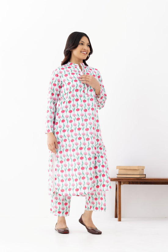 Woman wearing a floral White Pink Printed Co-ords Set With a Mandarin Collar and Side Pockets