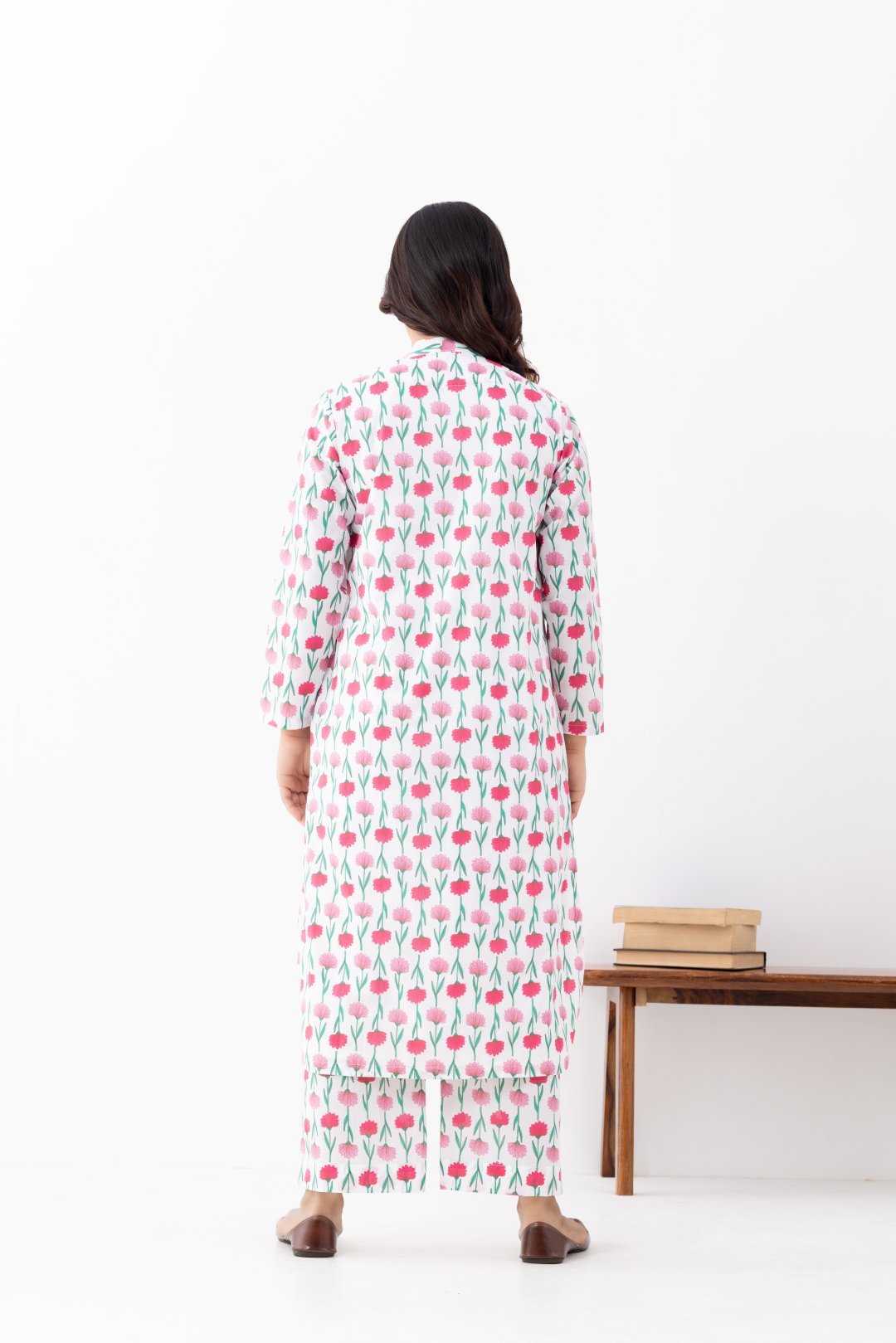 Woman wearing a floral White Pink Printed Co-ords Set With a Mandarin Collar and Side Pockets