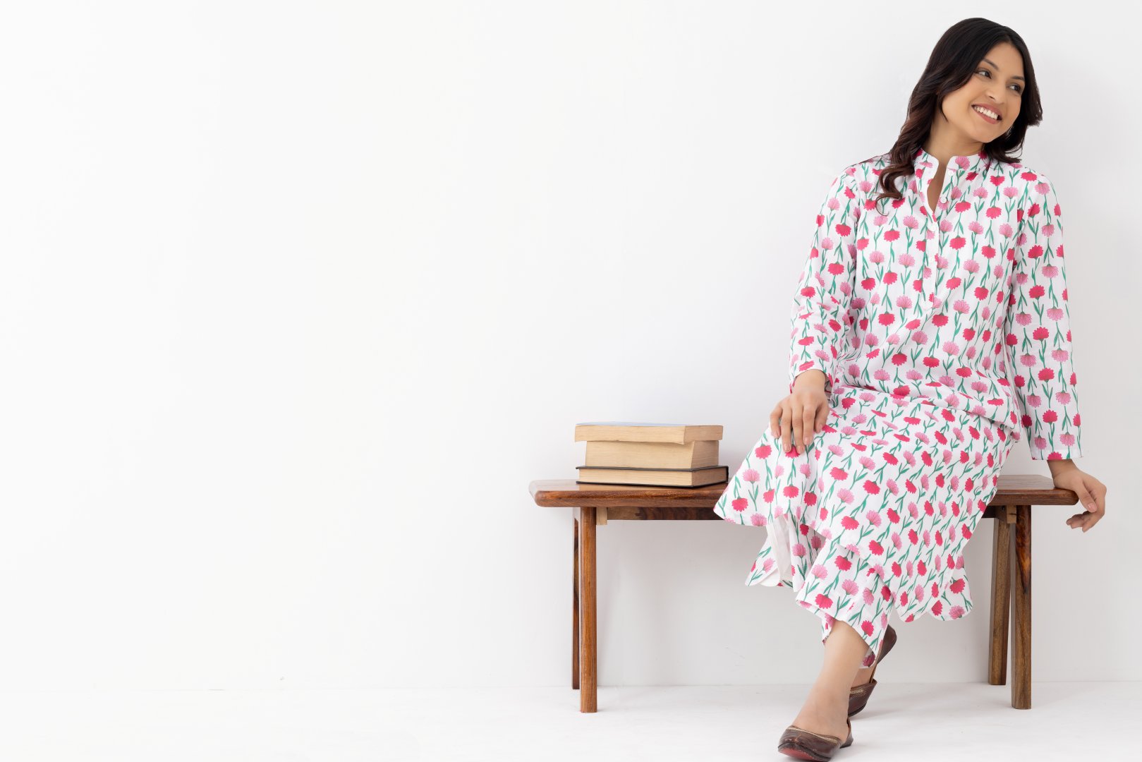 Woman wearing a floral White Pink Printed Co-ords Set With a Mandarin Collar and Side Pockets