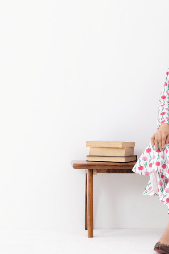 Woman wearing a floral White Pink Printed Co-ords Set With a Mandarin Collar and Side Pockets