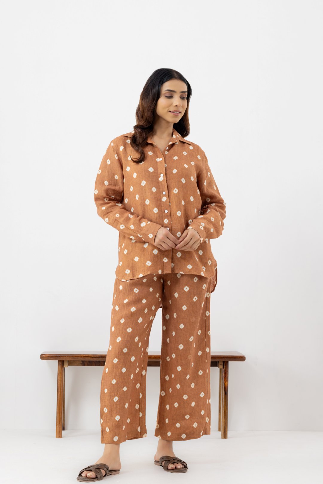 Woman wearing a brown polka dot line co-ords outfit 