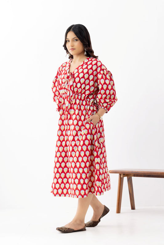 Woman wearing a pure linen cotton comfortable red and white block printed patterned dress with side pockets and 3/4th sleeves pockets